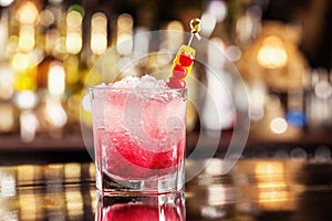 Glass of shirley temple cocktail decorated with cherry