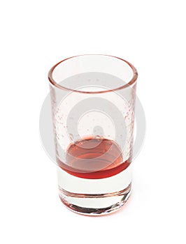 Glass shot with grenadine leftovers