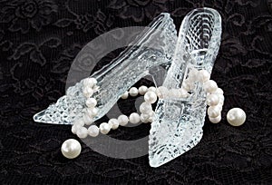 Glass slippers with pearls on a black lace