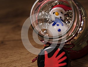 Glass snowman in a glass bottle with pearls