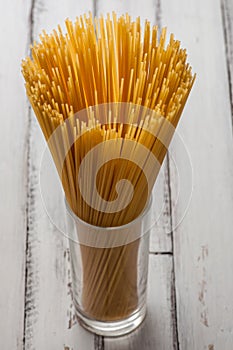 Glass with some dry spaghetti