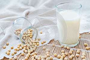 A glass of soymilk and soybeans