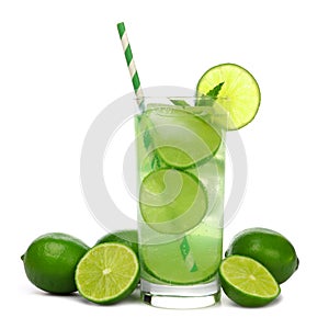 Glass of sparkling limeade with limes isolated on white