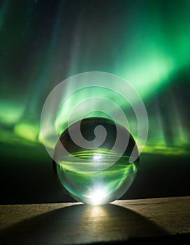 A glass sphere in front of northern light