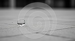 Glass Sphere Reflection on Gray Pavement