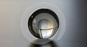 A glass sphere sits on a