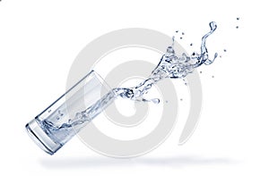 Glass with spilling water splash. Side view. On white background photo