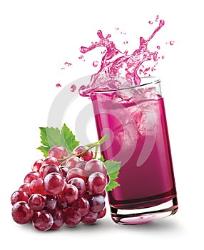 Glass of splashing grape juice with grape fruit on white background