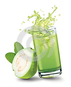 Glass of splashing guava juice with guava fruit on white background