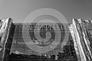 The glass and steel facade of a modern building in Poznan