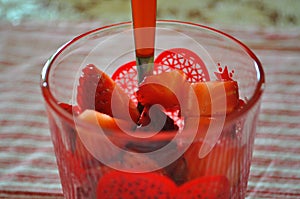 Glass with strawberries closeup