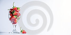 A glass of strawberries fruits with white background