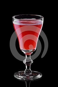 Glass of strawberry daiquiri cocktail isolated on black