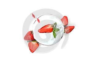Glass of strawberry milkshake and ingredients isolated on white background