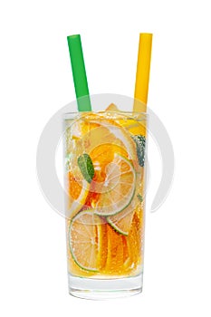 Glass with straws of homemade lemonade with sliced fresh lemon,