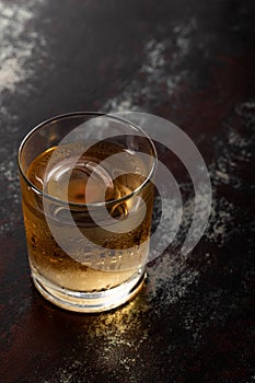 Glass with strong whiskey and ice