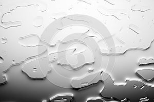 Glass surface with water drops, black and white color, shiny drops texture, wet background, monochrome gray dark to light gradient