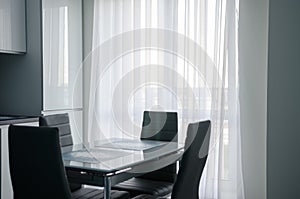 Glass table against the background of the window. Lunch background