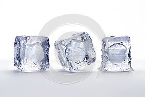 a glass table with three melting ice cubes on a white background