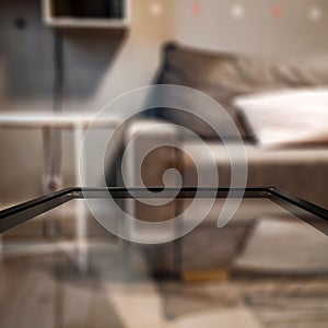 Glass table top with a blurred home interior background. Empty space background for you products and decoration.