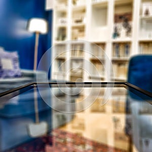 Glass table top with a blurred home interior background. Empty space background for you products and decoration.