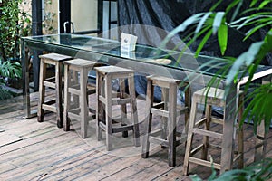 Glass table and wooden chairs, furniture set, beautiful dining table set