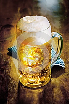 Glass tankard of cold golden ale or beer