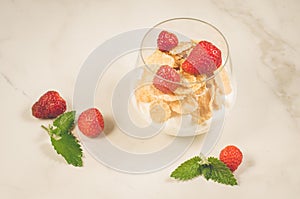 glass of tasty strawberry dessert on table/glass of tasty strawberry dessert on white table