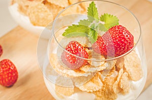 Glass of tasty strawberry dessert/two glass of tasty strawberry dessert on wooden tray, close up