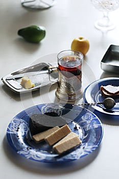 Glass of tea with glass holder.