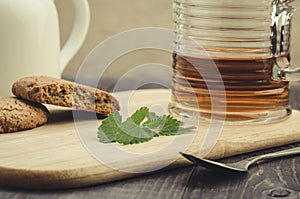 Glass of tea with mint and cookies/glass of tea with mint and co