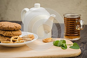 Glass of tea with mint and cookies/glass of tea with mint and co