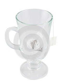 Glass teacup with a tea bag inside