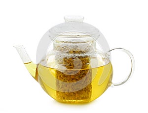 Glass teapot with camomile tea