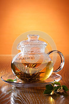 Glass teapot with greean tea