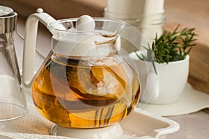 Glass teapot with herbal infussion
