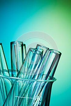 Glass test tubes together on the blue background