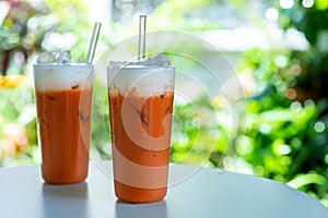 Glass of Thai iced tea with milk