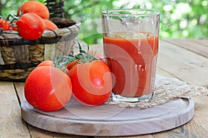 Glass of Tomato Juice and Fresh Tomatoes