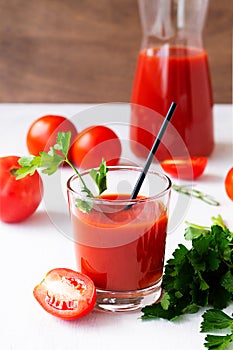 Glass of Tomato juice with parsley.