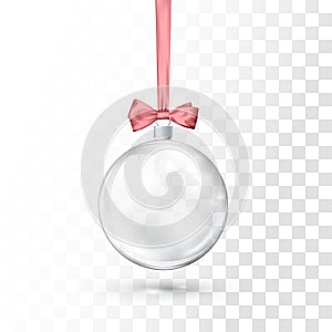 Glass transparent Christmas ball hanging on pink ribbon with bow. Xmas glass ball on transparent background. Holiday decoration