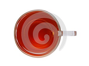 Glass transparent cup with hot tea. Isolated on a white background top view