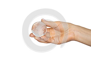 A glass transparent globe of the earth in the hand of a girl on a white background, a globe