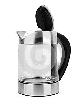 Glass transparent kettle on white kitchen table. Closeup. Nobody