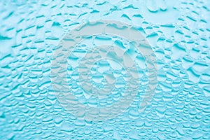 Glass with transparent water rain drops patterns. Sweated surface of cool beverage drink. Freshness hydration purity concept