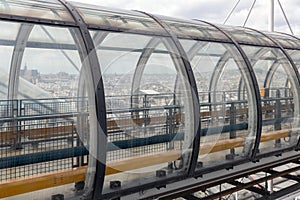 Glass tube corridor at Pompidou Centre with aerial view at Paris