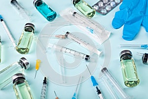 Glass vaccine ampoules, bottles, gloves, syringes, needles, pills