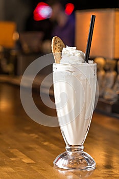 Glass of vanilla milkshake