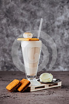 Glass of vanilla milkshake with whipped cream