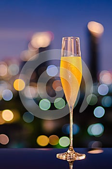 A glass with vapour of cold Champagne on table